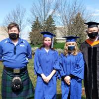 Dr. Baine and Dr. Dunne congratulate engineering graduates